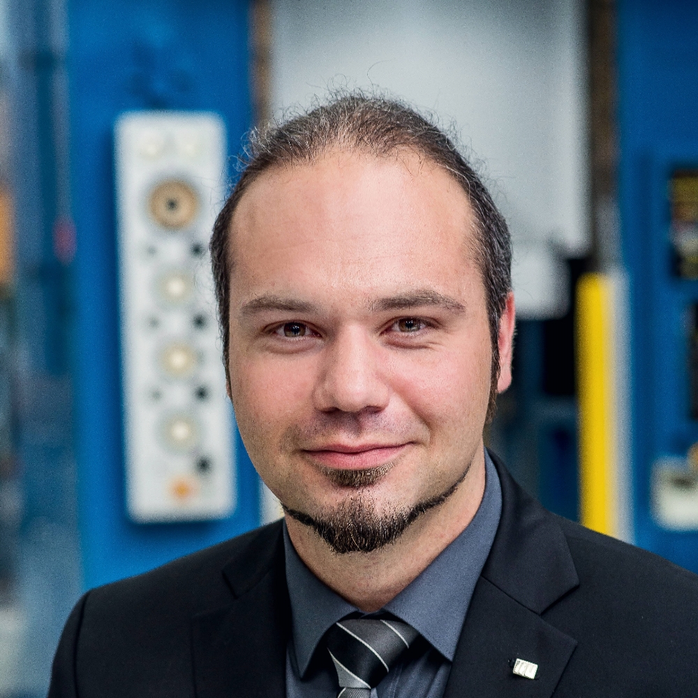 This image shows Dr.-Ing. Kim Rouven Riedmüller